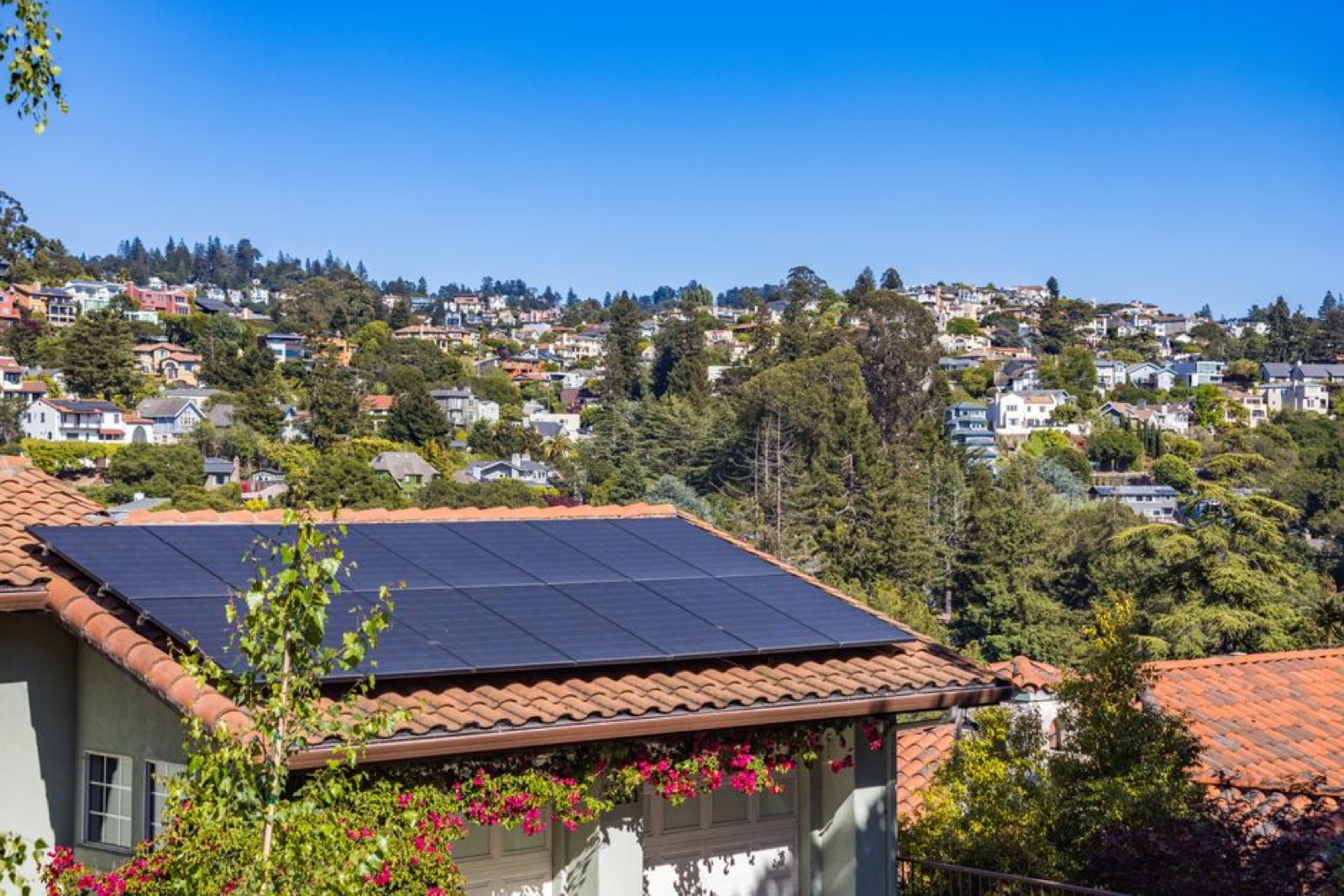Suburban home with solar panels representing energy independence and battery backup power