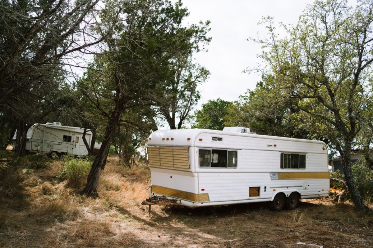 RV camper with portable generator at campground for off-grid power