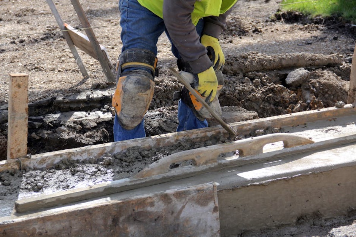 Construction worker at outdoor job site - typical commercial generator use case