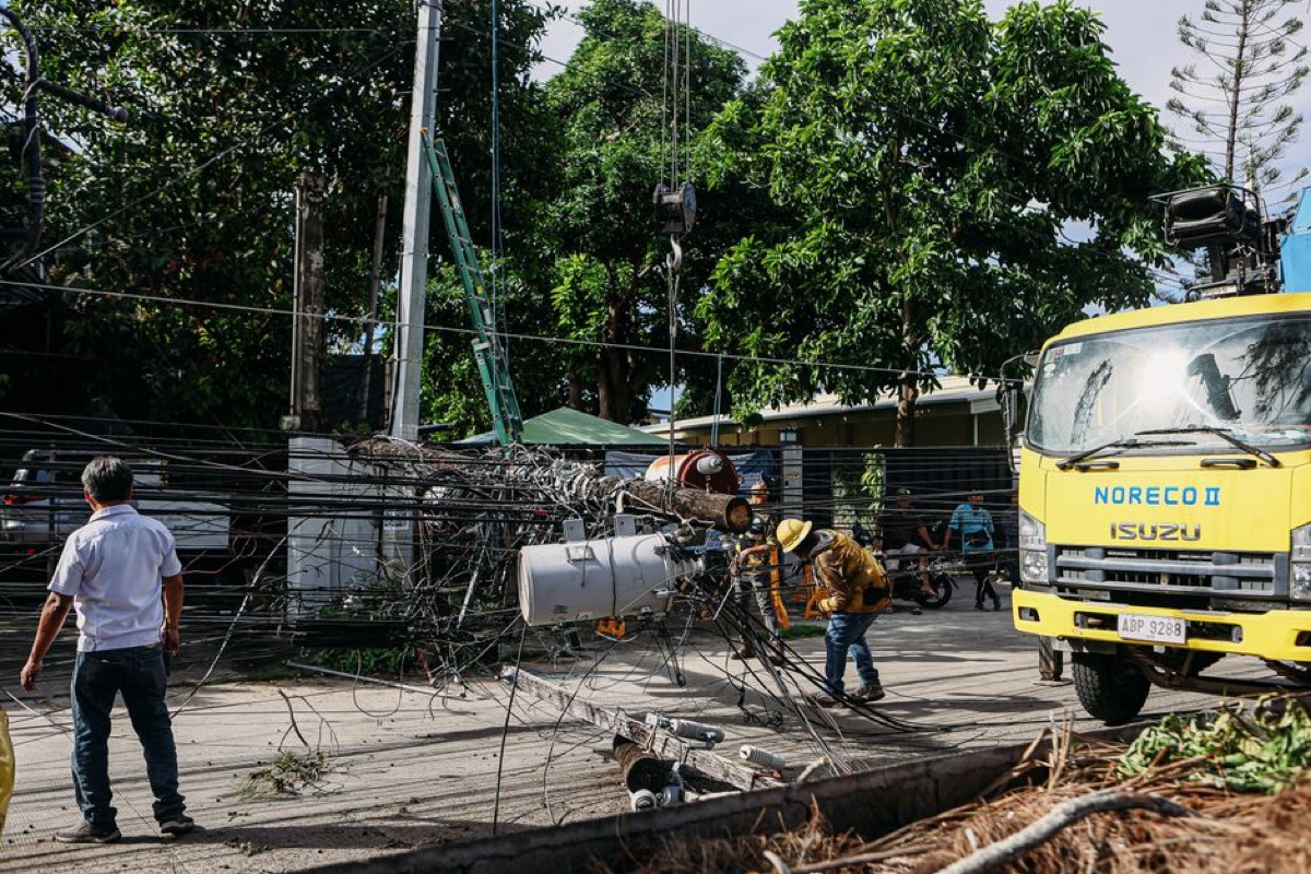 Utility crew repairing downed power lines after a storm
