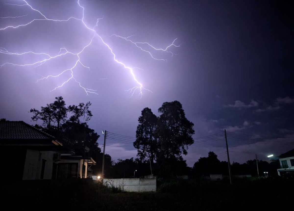 Lightning storm over residential neighborhood causing power outage requiring well pump generator backup